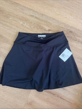 NWT forever 21 black skirt with biker shorts underneath. Size small.